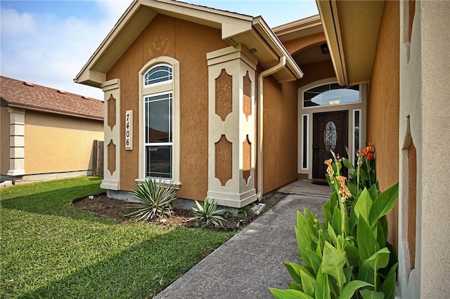 7406 Brush Creek Dr, Corpus Christi, TX 78414 - doorway to property with stucco siding and a yard