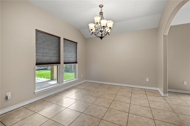 7406 Brush Creek Dr, Corpus Christi, TX 78414 - spare room with vaulted ceiling, a chandelier, light tile patterned flooring, arched walkways, and baseboards