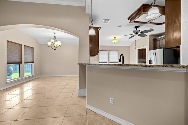 7406 Brush Creek Dr, Corpus Christi, TX 78414 - kitchen featuring stainless steel fridge with ice dispenser, a ceiling fan, plenty of natural light, and baseboards