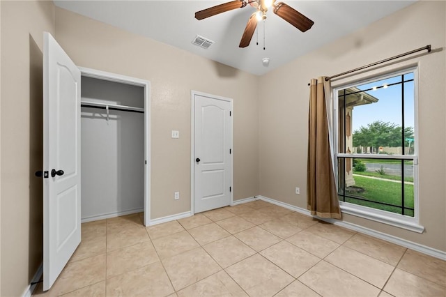 7406 Brush Creek Dr, Corpus Christi, TX 78414 - unfurnished bedroom with light tile patterned flooring, baseboards, a closet, and a ceiling fan