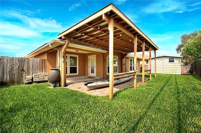 7406 Brush Creek Dr, Corpus Christi, TX 78414 - back of house featuring stucco siding and a patio area