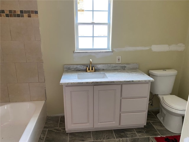 bathroom featuring toilet and vanity