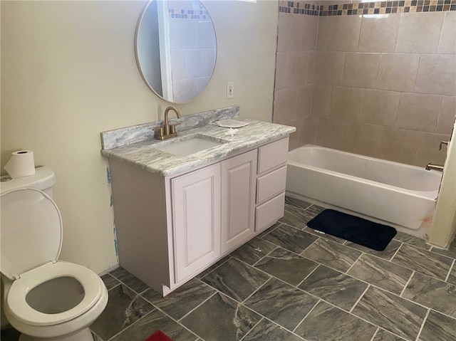 full bathroom featuring toilet, vanity, and tiled shower / bath