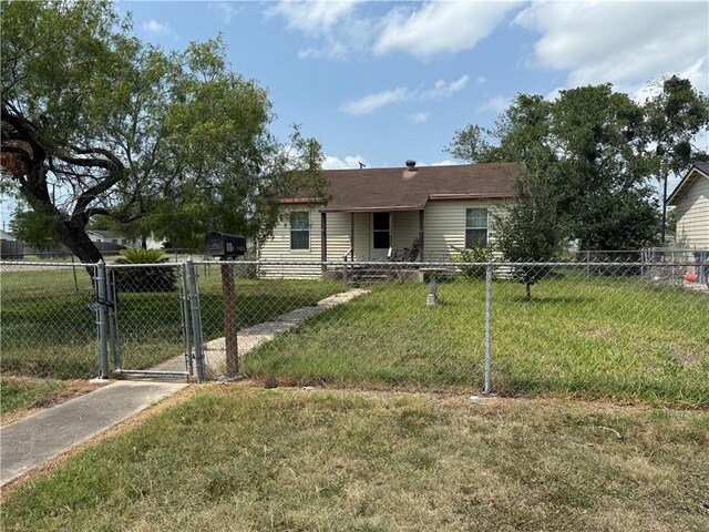 101 E Joyce St, Bishop, TX 78343 - view of front of house with a gate