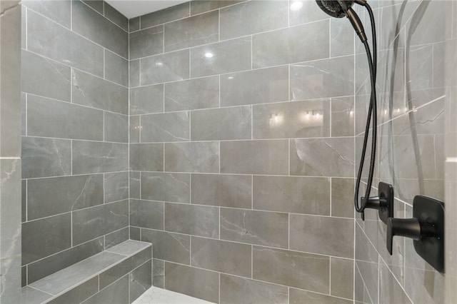 bathroom with a tile shower