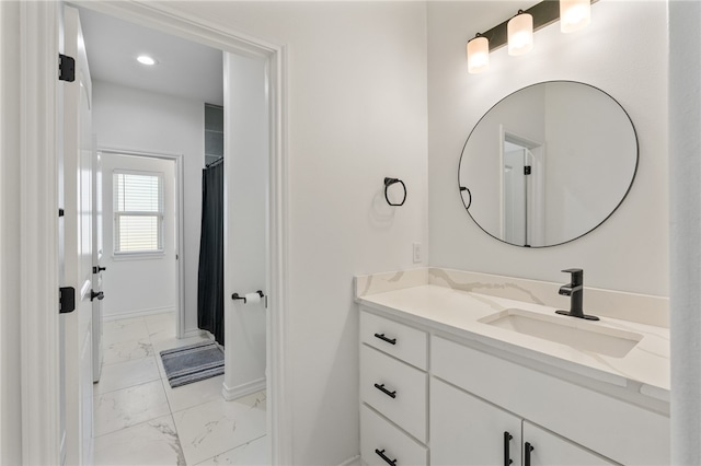 bathroom with vanity and curtained shower