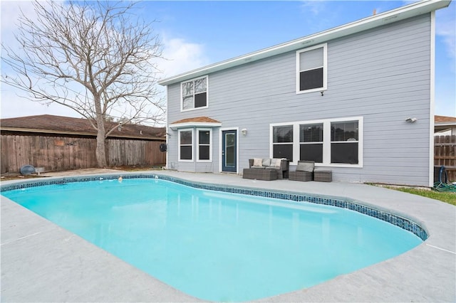 view of swimming pool with an outdoor hangout area, a fenced backyard, and a fenced in pool