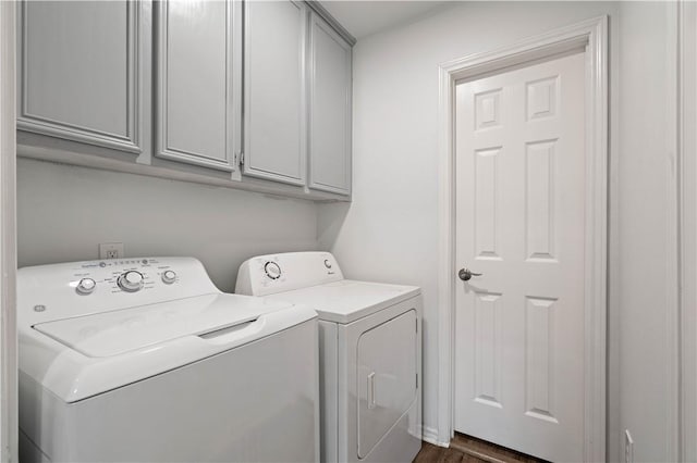 laundry area with cabinet space and washing machine and clothes dryer