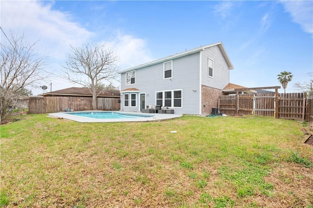 back of property with a fenced in pool, a fenced backyard, a yard, a pergola, and brick siding