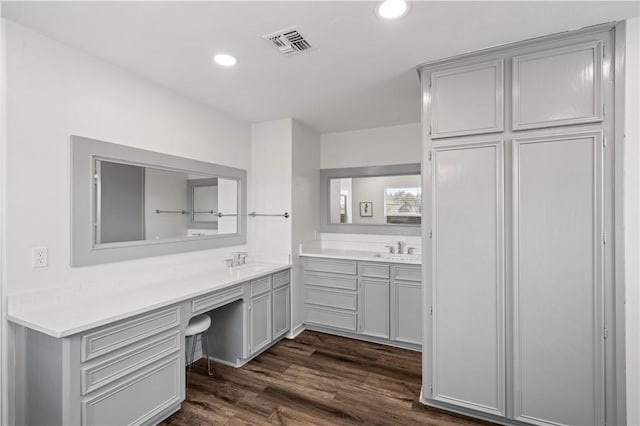 bathroom featuring recessed lighting, visible vents, wood finished floors, and vanity