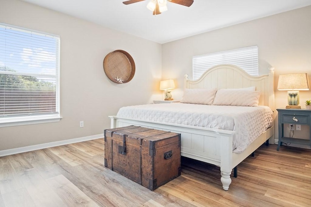 906 S Young St, Rockport, TX 78382 - bedroom with light wood-style floors, baseboards, and ceiling fan