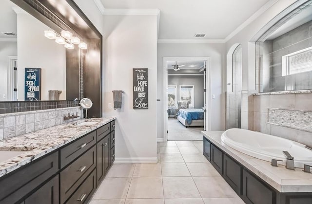 5716 S Oso Pkwy, Corpus Christi, TX 78414 - bathroom featuring ensuite bathroom, vanity, crown molding, a bath, and baseboards