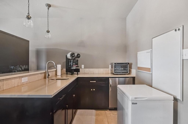 5716 S Oso Pkwy, Corpus Christi, TX 78414 - kitchen with a sink, fridge, and light countertops