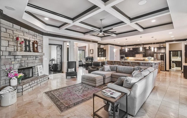 5716 S Oso Pkwy, Corpus Christi, TX 78414 - living area featuring ornamental molding, coffered ceiling, ceiling fan, beam ceiling, and a fireplace