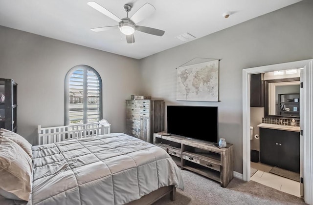 5716 S Oso Pkwy, Corpus Christi, TX 78414 - carpeted bedroom with ensuite bath and a ceiling fan