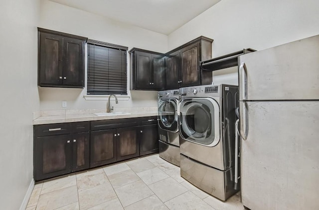 5716 S Oso Pkwy, Corpus Christi, TX 78414 - laundry area with cabinet space and washer and dryer