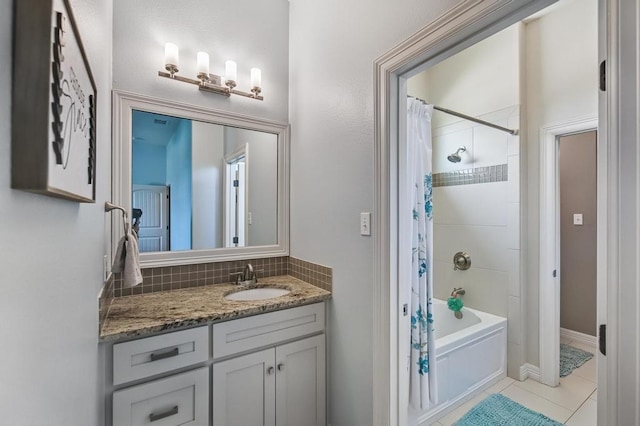5716 S Oso Pkwy, Corpus Christi, TX 78414 - full bath with vanity, shower / bath combination with curtain, backsplash, and tile patterned flooring