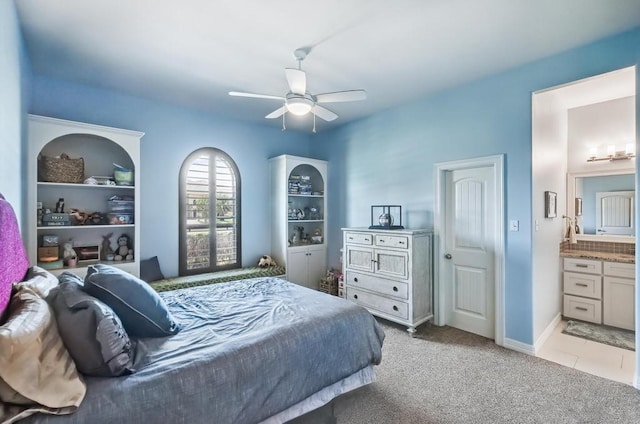 5716 S Oso Pkwy, Corpus Christi, TX 78414 - bedroom featuring light carpet, connected bathroom, and ceiling fan