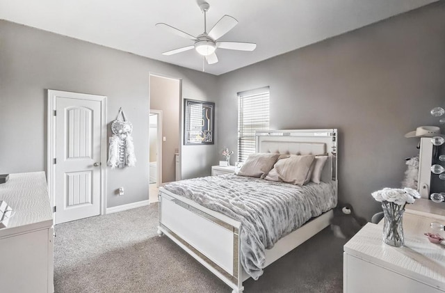 5716 S Oso Pkwy, Corpus Christi, TX 78414 - carpeted bedroom with ensuite bathroom, baseboards, and a ceiling fan