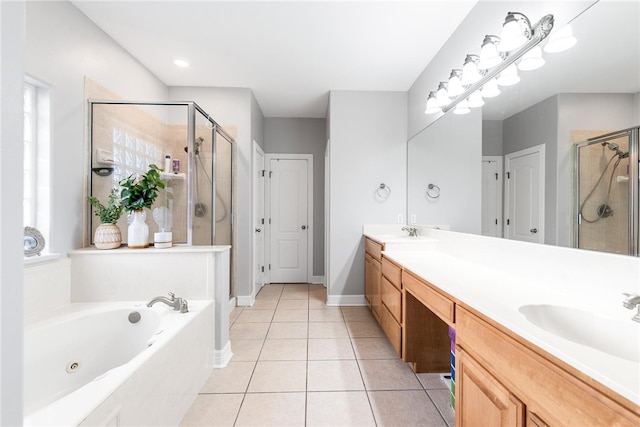 bathroom with independent shower and bath, vanity, and tile patterned flooring