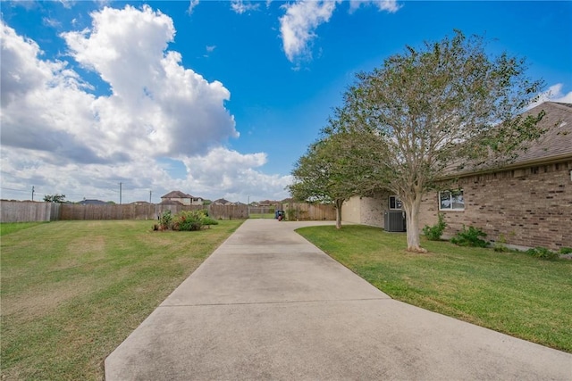 5309 Fox Glove, Corpus Christi, TX 78413 - view of yard featuring concrete driveway and central AC