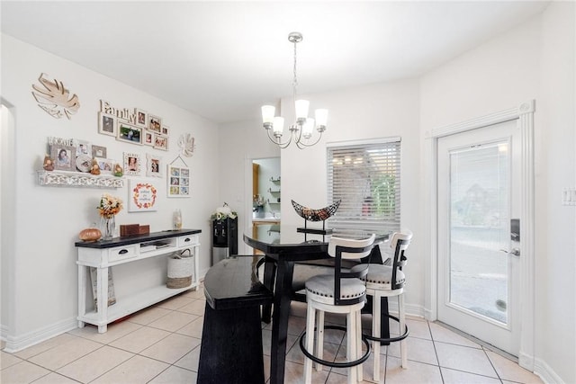 5309 Fox Glove, Corpus Christi, TX 78413 - dining space featuring light tile patterned floors, a chandelier, and baseboards