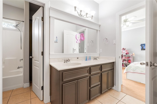 bathroom featuring ceiling fan, vanity, tile patterned floors, and shower / bathtub combination