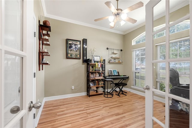 office area featuring ornamental molding, french doors, plenty of natural light, and light hardwood / wood-style flooring