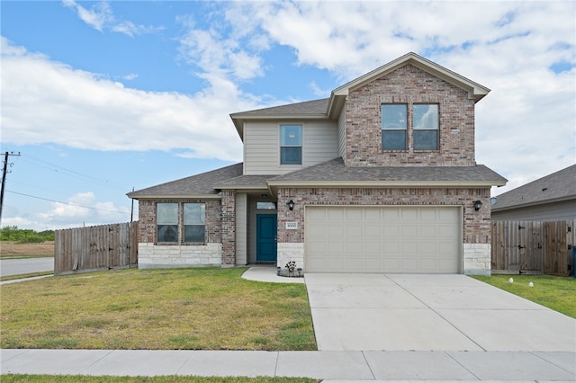 view of front of house with a garage and a front yard