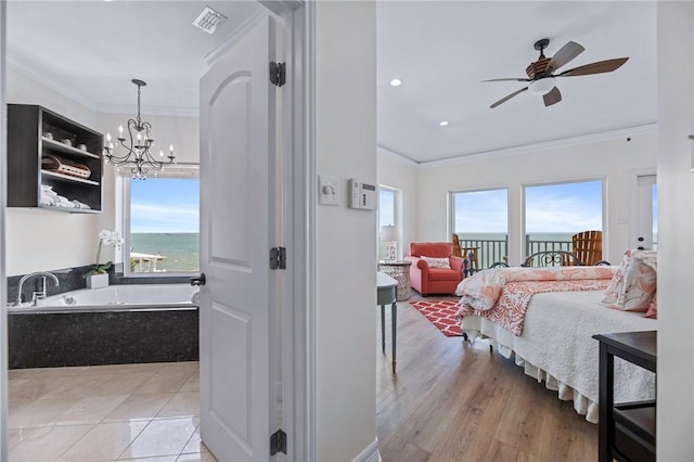 317 Bayview Dr, Aransas Pass, TX 78336 - bedroom with ornamental molding, a chandelier, and access to exterior