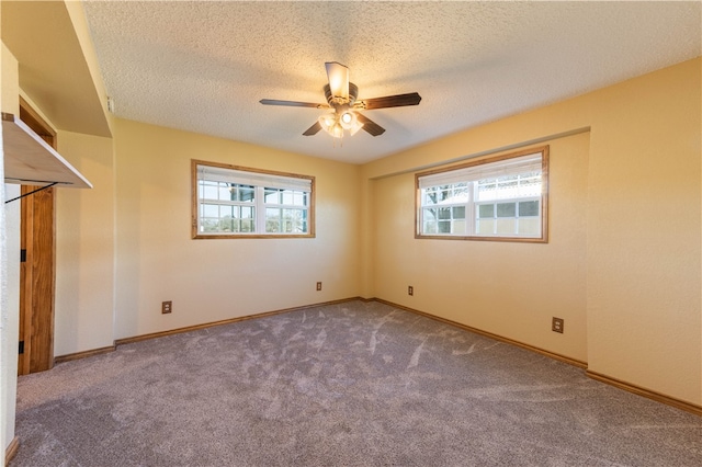 unfurnished bedroom with ceiling fan, a textured ceiling, and carpet