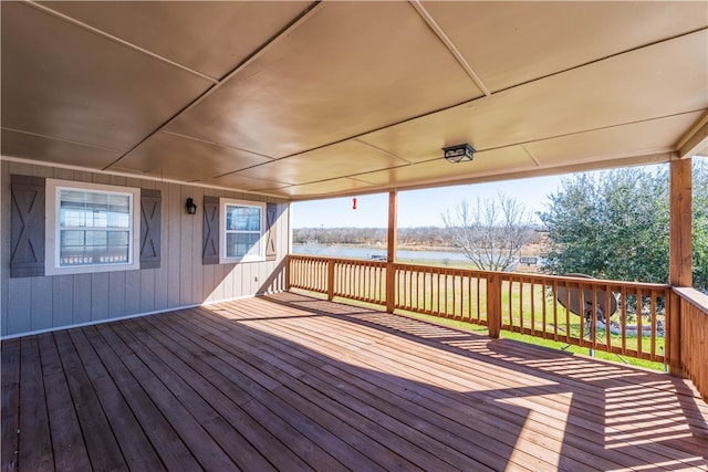 wooden terrace with a water view