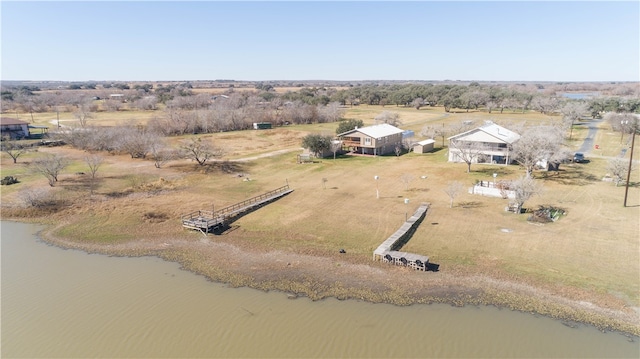 drone / aerial view featuring a rural view and a water view