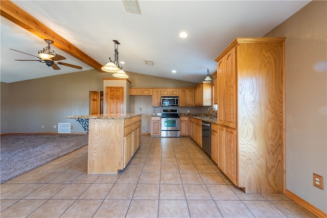 kitchen featuring light stone counters, light tile patterned flooring, vaulted ceiling with beams, stainless steel appliances, and sink