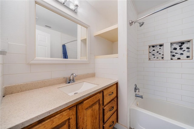 bathroom featuring backsplash, shower / bathtub combination with curtain, vanity, and tile walls