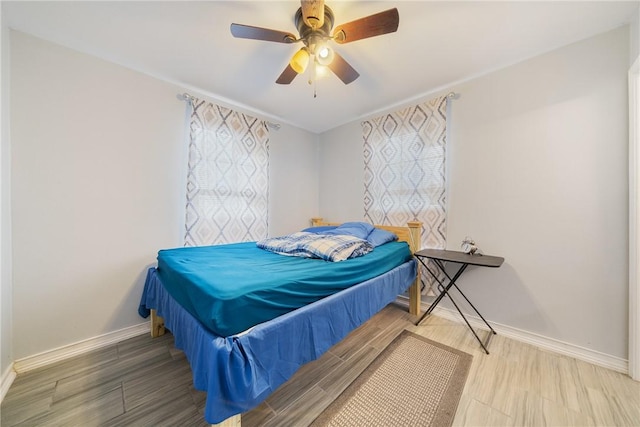 bedroom with wood-type flooring and ceiling fan