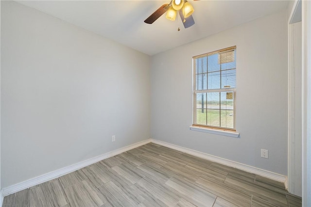 spare room featuring ceiling fan and light hardwood / wood-style floors