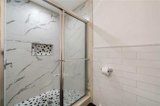 bathroom with a shower with shower door