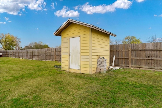 view of outbuilding featuring a lawn