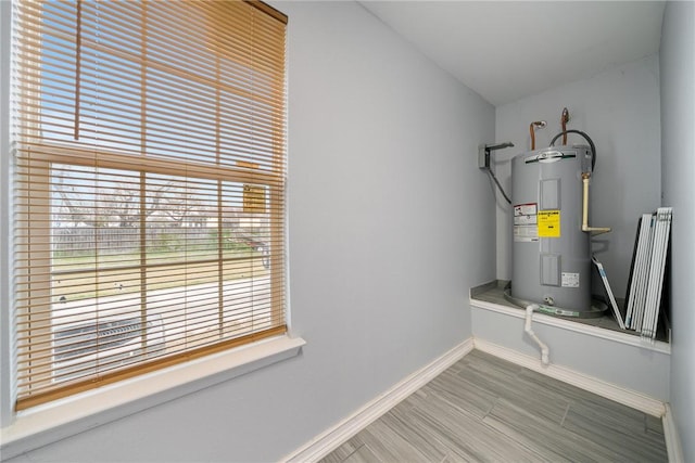 utility room featuring water heater