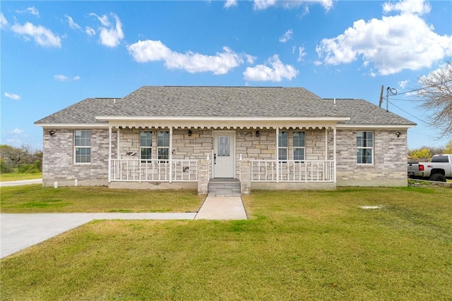 view of front of home with covered porch and a front yard