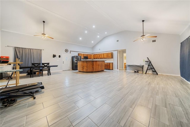 living room with ceiling fan and lofted ceiling