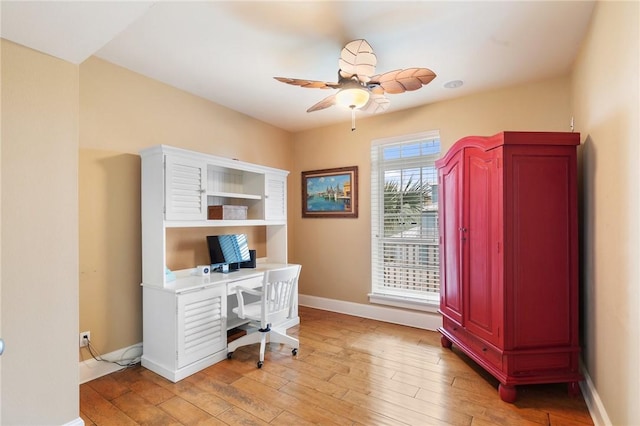 office space with ceiling fan and light wood-type flooring