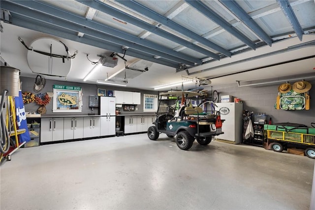 garage featuring a garage door opener