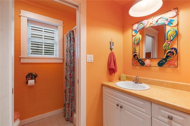 bathroom with tile patterned floors and vanity