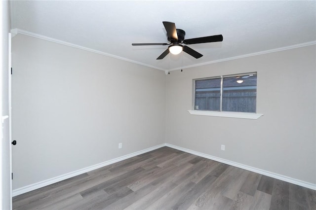 empty room featuring ceiling fan, wood-type flooring, and crown molding