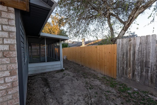 view of side of property featuring a sunroom