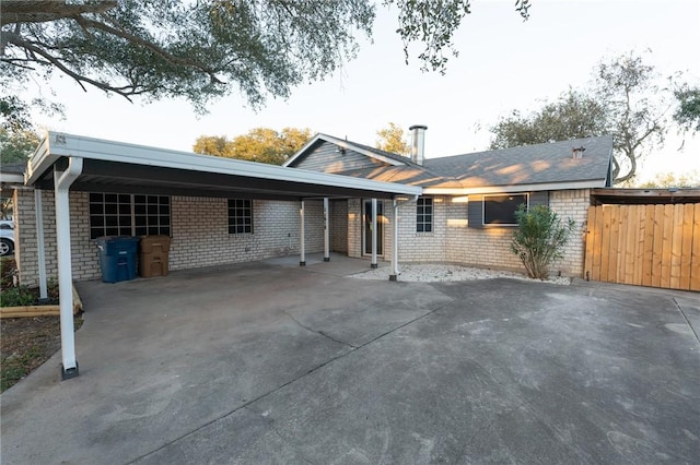 view of front of home featuring a carport