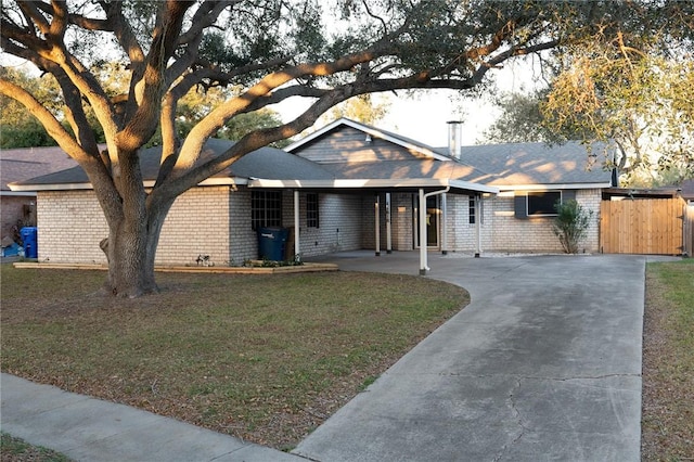 ranch-style home with a front lawn