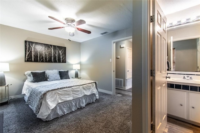 7322 Milky Way Dr, Corpus Christi, TX 78412 - carpeted bedroom with ensuite bathroom and a ceiling fan